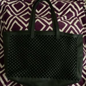 Daph brand, 100% leather tote bag w/ suede and a woven leather design on front.